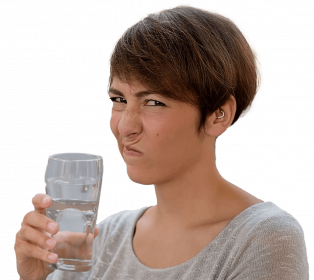 woman cringing from bad tasting water